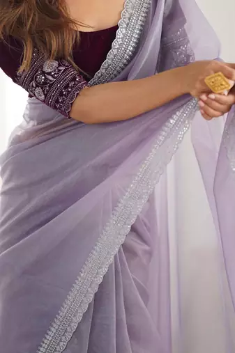 Purple sequinned net saree