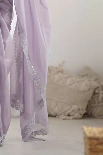 Purple sequinned net saree