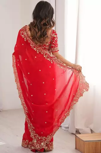 Red ethnic motifs embroidered satin heavy work saree
