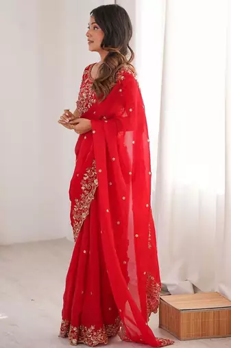 Red ethnic motifs embroidered satin heavy work saree