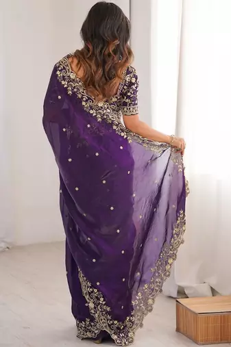 Purple ethnic motifs embroidered satin heavy work saree