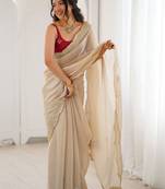 Cream embellished sequinned satin heavy work saree