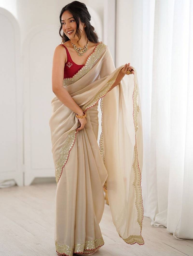 Cream embellished sequinned satin heavy work saree