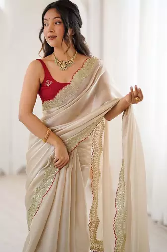 Cream embellished sequinned satin heavy work saree
