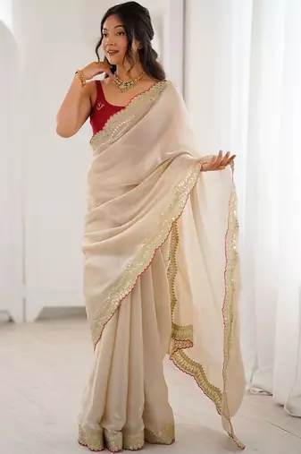 Cream embellished sequinned satin heavy work saree