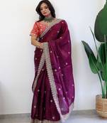 Burgundy ethnic motifs embroidered sequinned organza saree
