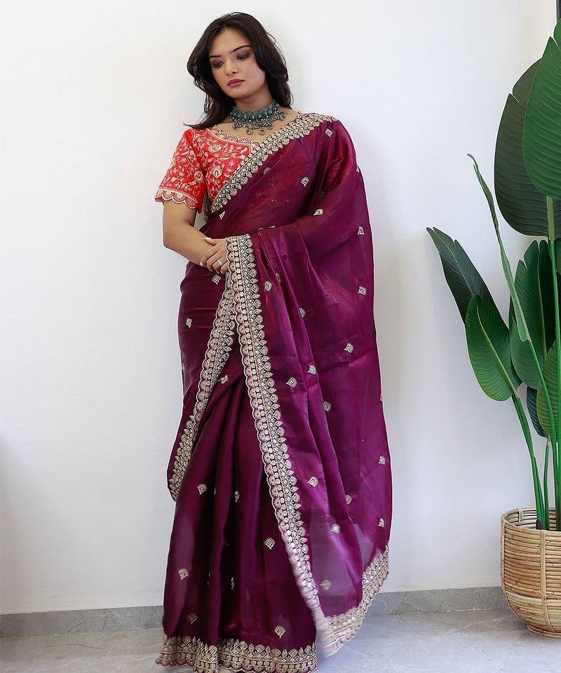 Burgundy ethnic motifs embroidered sequinned organza saree
