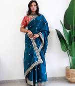 Teal floral embroidered organza saree
