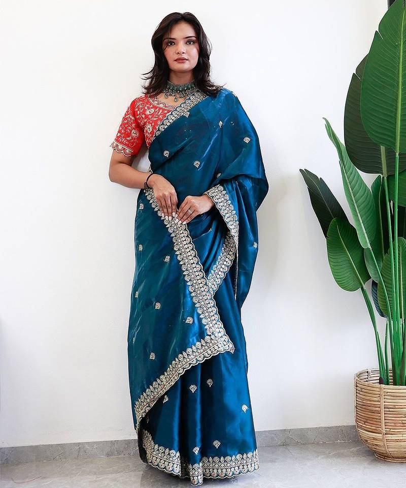 Teal floral embroidered organza saree