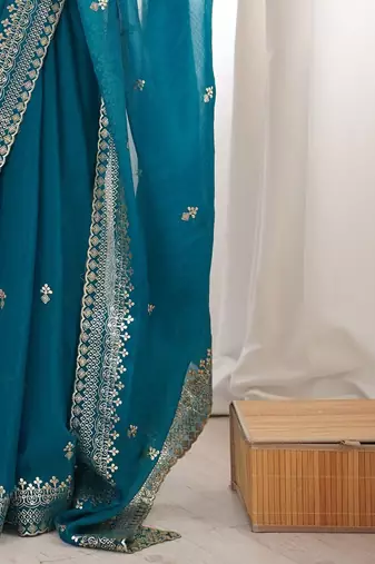 Teal ethnic motifs zari satin heavy work saree