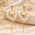 Anti-tarnish, stud back closure, dangling chain, puffy heart charm