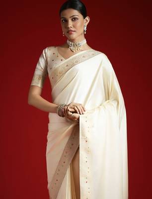 Cream cream solid zari woven design satin banarasi saree with matching blouse 1