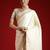 Cream cream solid zari woven design satin banarasi saree with matching blouse