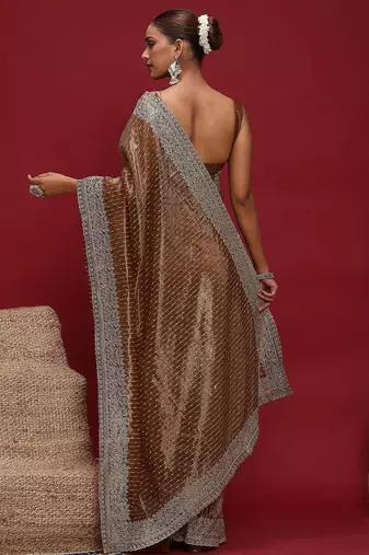 Brown brown embellished zari net designer striped saree