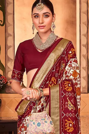 Off white ethnic motifs zari silk blend patola saree