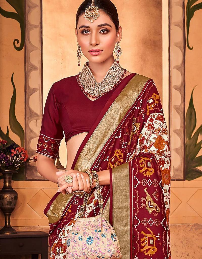 Off white ethnic motifs zari silk blend patola saree