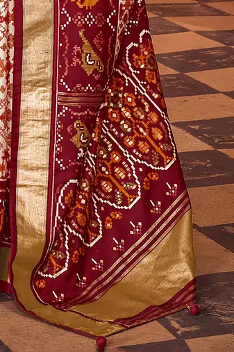 Off white ethnic motifs zari silk blend patola saree