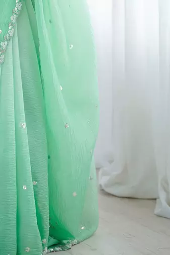 Sea green embroidered ombre embellished beads and stones border  chiffon party wear saree