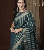 Teal zari woven striped  georgette kanjeevaram saree