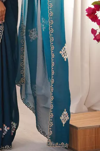 Teal embellished mirror work tissue heavy work saree
