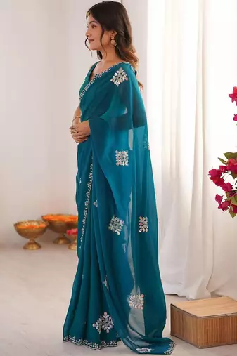 Teal embellished mirror work tissue heavy work saree