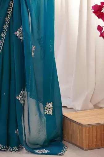 Teal embellished mirror work tissue heavy work saree