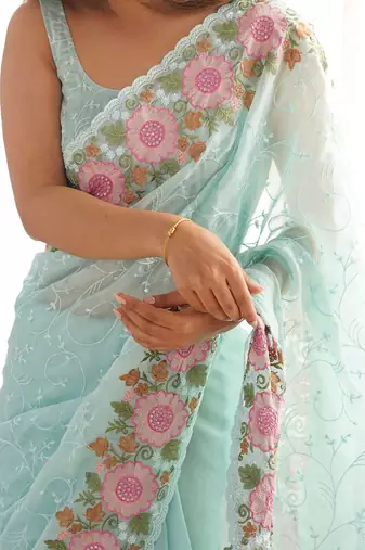Turquoise embroidered sequinned  georgette saree