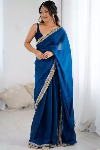 Blue ethnic motifs embroidered satin saree