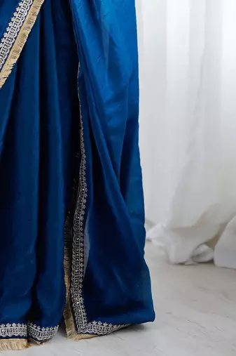 Blue ethnic motifs embroidered satin saree