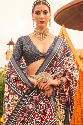 Cream ethnic motifs printed designer patola saree