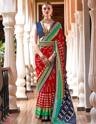 Red ethnic motifs woven design zari ikat saree 1