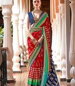 Red ethnic motifs woven design zari ikat saree