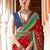 Red ethnic motifs woven design zari ikat saree