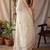 Off white checked woven design zari silk blend saree with blouse