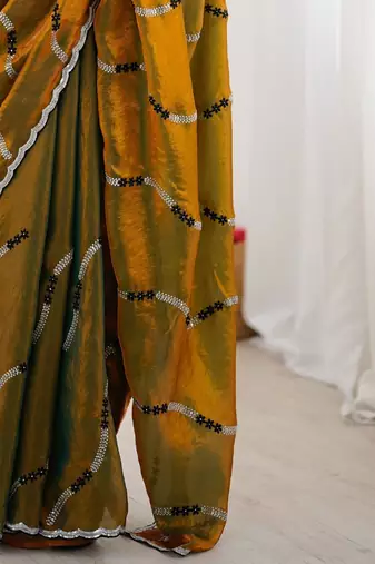 Gold embellished embroidered satin saree