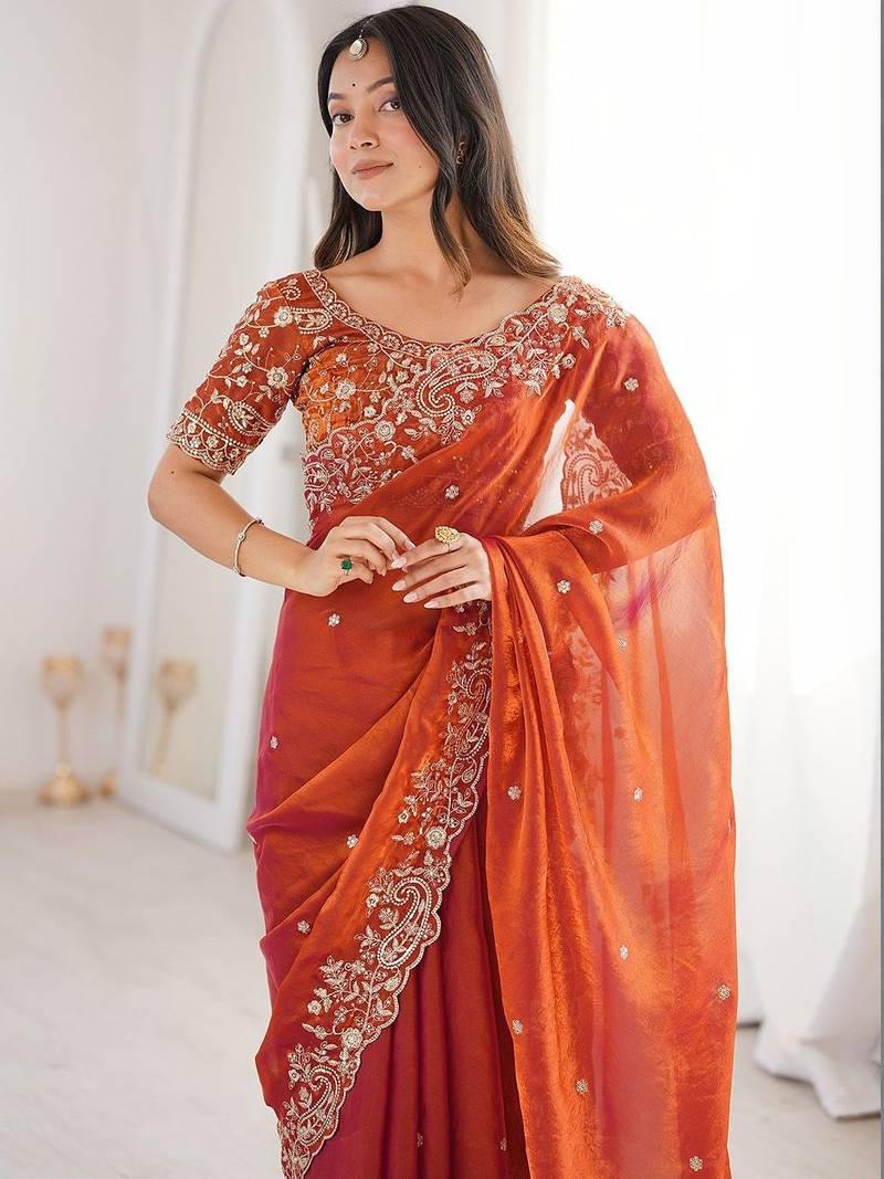 Rust ethnic motifs embroidered satin heavy work saree