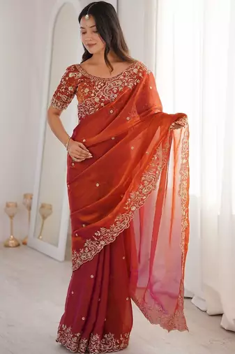 Rust ethnic motifs embroidered satin heavy work saree