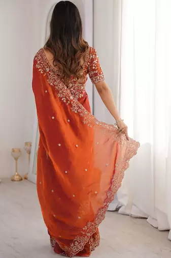 Rust ethnic motifs embroidered satin heavy work saree