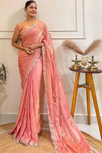 Peach embellished embroidered satin saree