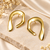 Gold-toned abstract arch stud earrings, anti-tarnish