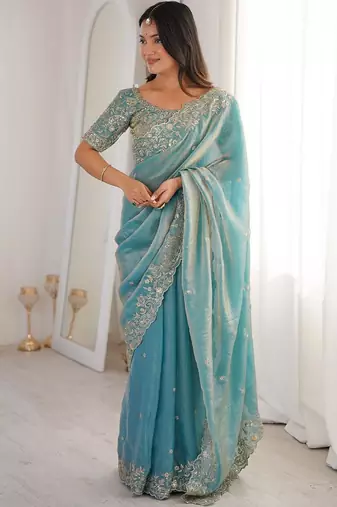Turquoise embellished embroidered satin heavy work saree