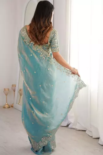 Turquoise embellished embroidered satin heavy work saree