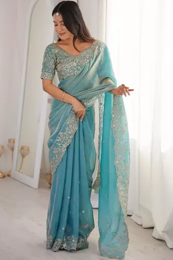 Turquoise embellished embroidered satin heavy work saree