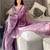 Purple purple striped embroidered organza saree