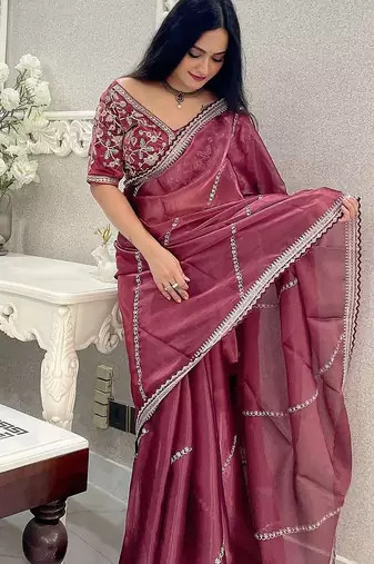 Rust floral embroidered organza saree
