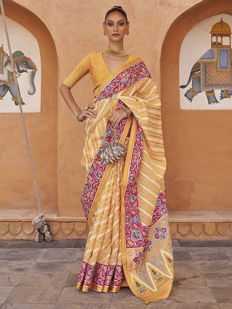 Cream cream & pink leheriya printed zari organza banarasi saree