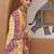 Cream cream & pink leheriya printed zari organza banarasi saree