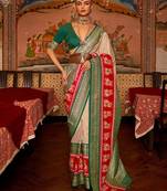 Beige ethnic woven zari patola saree