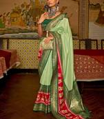 Green green & red ethnic motifs woven design patola saree