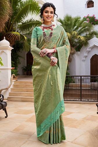 Green woven design zari chanderi saree with blouse piece